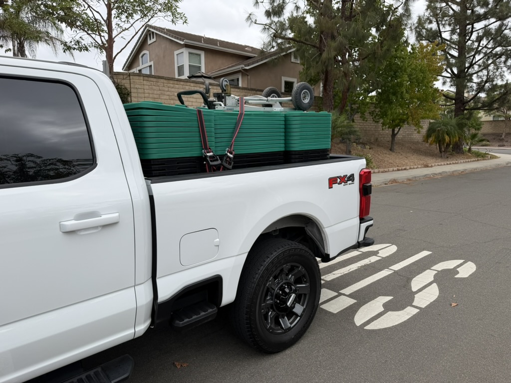 Truck full of moving totes parked in a Ventura County neighborhood